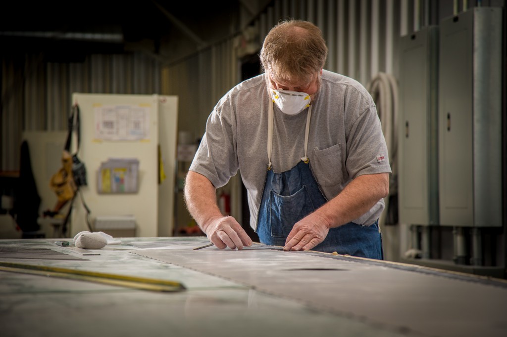 I.C.E. Technician laminating carbon fiber