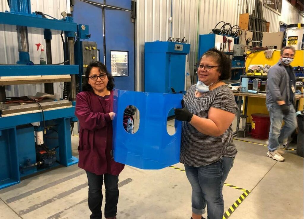 I.C.E team members with completed shield blank for hospital gowns