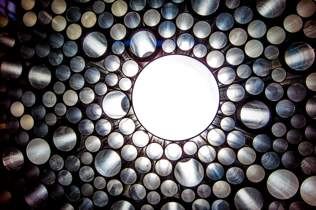 Looking up into composite tubes with varying diameters, thicknesses, fibers, etc